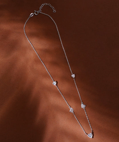 Silver Necklace with Multiple Heart Accents